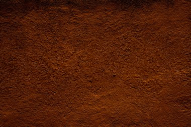 Zengin kahverengi desenli bir yüzeyi gösteren, topraksı ve organik desenleri ileten bir resim. Detay ve derinlik grafik tasarımı için uygun bir arkaplan oluşturur veya doğal temalı bir arkaplan.