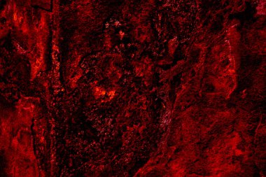 Koyu kırmızı ve turuncu gölgelere sahip, kızgın lavlara benzeyen dokulu bir yüzeyin yoğun görüntüsü. Sıcaklığı ve volkanik elementleri sembolize eder.