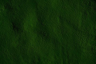 Canlı doğal tonlara sahip desenli yeşil yüzey, arka plan veya sanatsal tasarımlar için ideal.