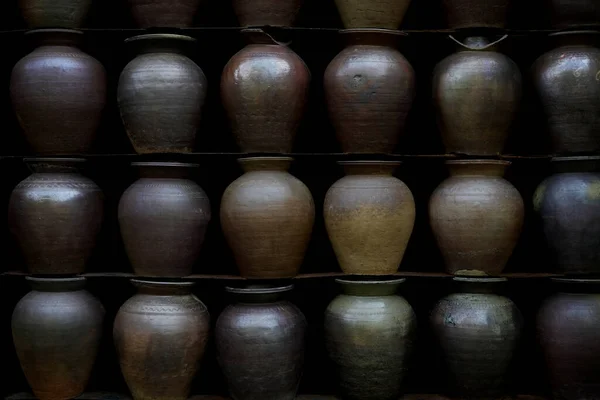 Old Pottery Earthenware Jars Shelf Black Wall — Stock Photo, Image