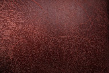 Eski kırmızı deri yastık yüzeyi