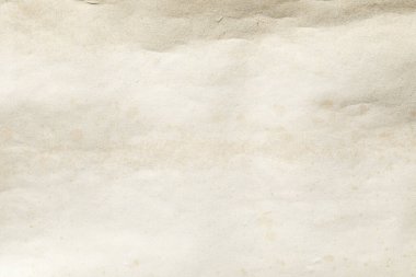 Kahverengi lekeli eski, sararmış bir kağıt.