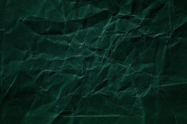 Koyu yeşil buruşmuş kağıt dokusu