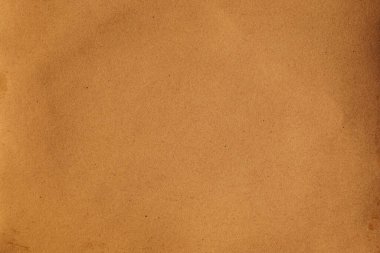 Noktalı ve lifli tahıl çizgileri olan kahverengi kağıt makro.