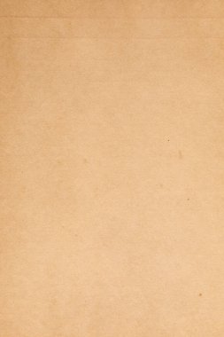 Kirli lekeli eskimiş kahverengi kağıt.