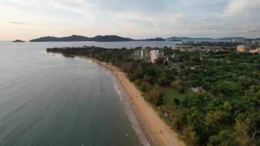 Kota Kinabalu, Malaysia  May 30 2024: The Tanjung Aru Beach During Sunset clipart