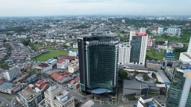 Kuching, Malaysia - June 21 2024: Aerial View of Landmark Buildings in Kuching City clipart