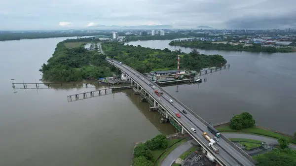 stock image Kuching, Malaysia - July 1 2024: The Isthmus with the Twin Towers, Barrage and Borneo Convention Centre Kuching