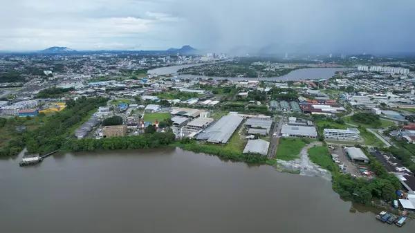 stock image Kuching, Malaysia - July 1 2024: The Isthmus with the Twin Towers, Barrage and Borneo Convention Centre Kuching