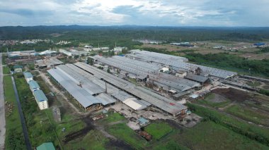 Bintulu, Malaysia - November 23, 2024: The Factories of Jepak Industrial Estate along Kemena River clipart