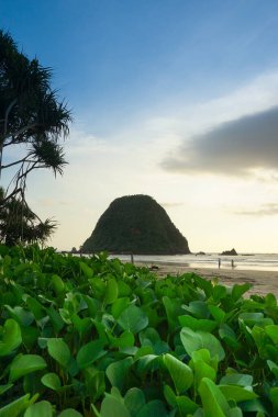 Breathtaking sunset at Pulau Merah beach in banyuwangi, Indonesia