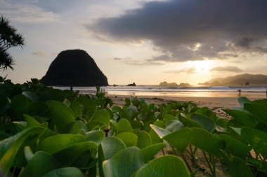 Beautiful scenery at Pulau Merah beach in banyuwangi, Indonesia.