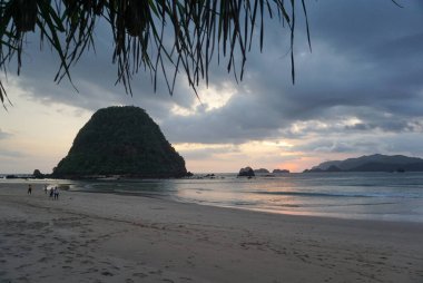 Breathtaking sunset at Pulau Merah beach in banyuwangi, Indonesia