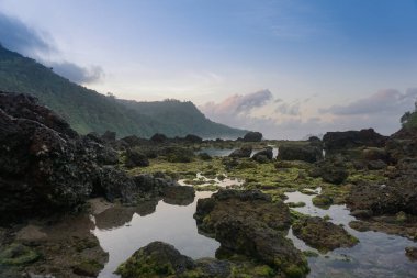Beautiful scenery at Pulau Merah beach in banyuwangi, Indonesia.