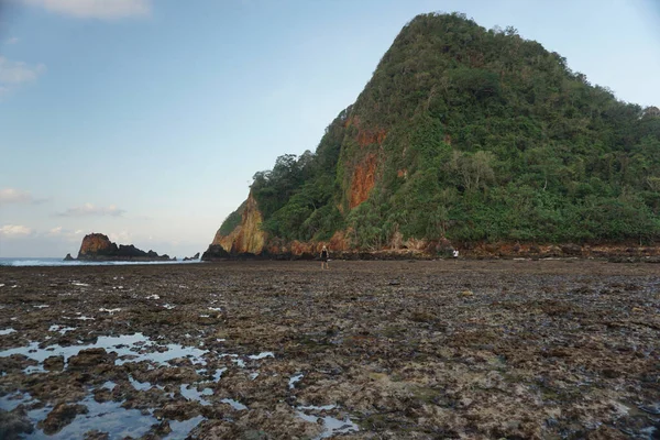 Breathtaking sunset at Pulau Merah beach in banyuwangi, Indonesia