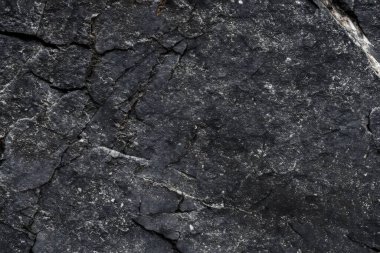 Koyu gri, siyah taş arka plan. Kaya dokusu. Siyah sayfa arkaplanı