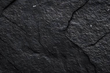 Koyu gri, siyah taş arka plan. Kaya dokusu. Siyah sayfa arkaplanı