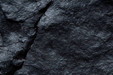 Koyu gri, siyah taş arka plan. Kaya dokusu. Siyah sayfa arkaplanı