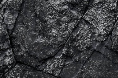 Koyu gri, siyah taş arka plan. Kaya dokusu. Siyah sayfa arkaplanı