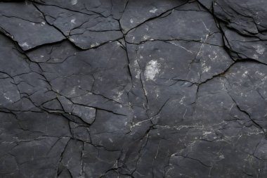 Koyu gri, siyah taş arka plan. Kaya dokusu. Siyah sayfa arkaplanı