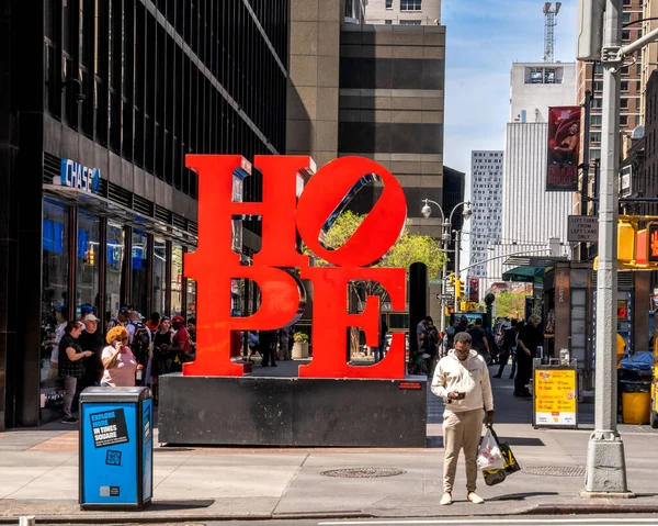 stock image New York, NY - USA - April 14, 2023 View of Robert Indiana's iconic HOPE sculpture at W 53rd Street at 7th Avenue.