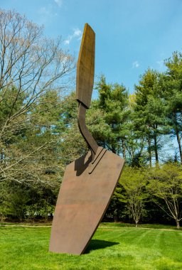 Purchase, NY  US  Apr 28, 2024 Pop artist Claes Oldenburgs Giant Trowel II, a monumental aluminum and steel piece in the Donald M Kendall Sculpture Gardens at the PepsiCo World headquarters.