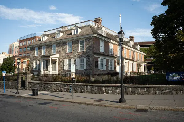 stock image Yonkers, NY - US - Sep 21, 2024 Horizontal view of Yonkers' Philipse Manor Hall State Historic Site, a historic colonial mansion with stone and brick architecture, shuttered windows.