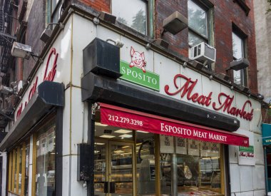 New York, NY - US - Jun 17, 2025 Esposito Meat Market in NYC features a iconic storefront with bold signage, red awning, and fresh meat cuts visible inside, offering a classic butcher shop experience.