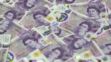 English twenty pounds rotating on the table