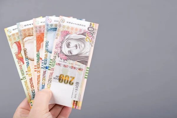 Peruvian Money Soles Hand Gray Background — Fotografia de Stock