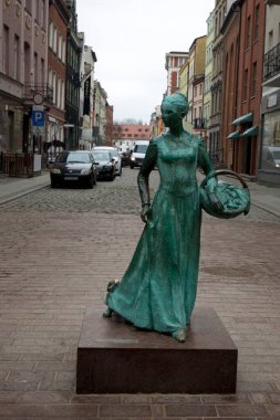 Monument of gingerbread maker on the streets of Torun, Poland