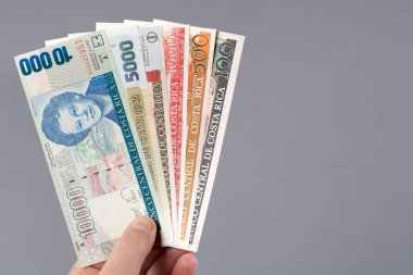 Kosta Rika parası - Gri arkaplanda Colones 'un eli - en eski serie