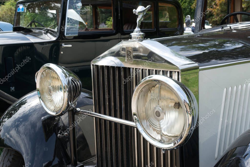 Rolls Royce HP 20/25 from 1933 with the Flying Lady mascot exposed during the 46. International Oldtimer-Meeting in Baden-Baden, Germany, 2023. In the background, a black Rolls Royce HP 20/25 from 1934.