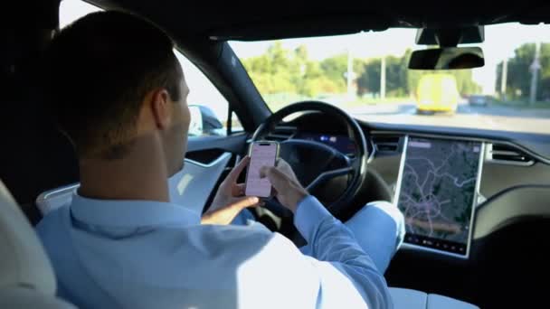Successful Businessman Browsing Modern Smartphone While Riding Autonomous Self Driving Stock Video