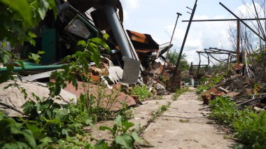 View to destroyed residential buildings at Kharkivska oblast. Ruined houses after bomb attacks on ukrainian territory from russia army. Consequences of russian invasion of Ukraine. Slow mo clipart