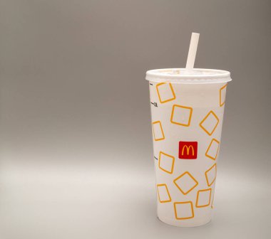 Bucharest, Romania - 01.28.2023: mcdonalds restaurant paper cup with straw