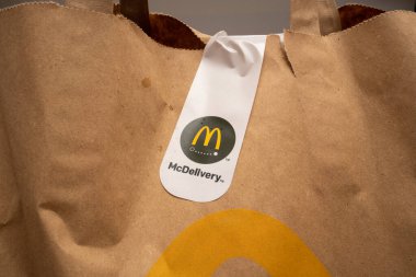 Bucharest, Romania - 01.28.2023: McDelivery sticker on dilivered food package