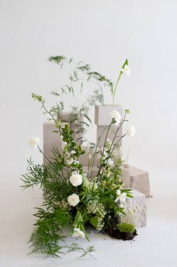 A serene floral arrangement blending nature's beauty with minimalist design elements in a soft, elegant backdrop clipart