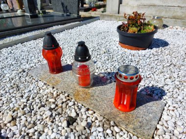 lampions on cemetery in Maribor. Slovenia. Plastic candles clipart