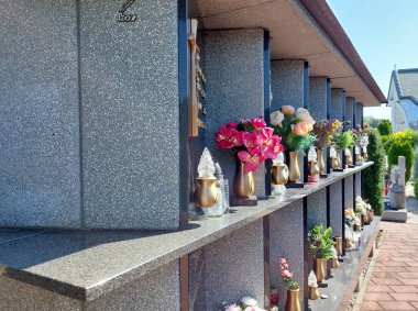 columbarium in Maribor. Flowers and candles clipart