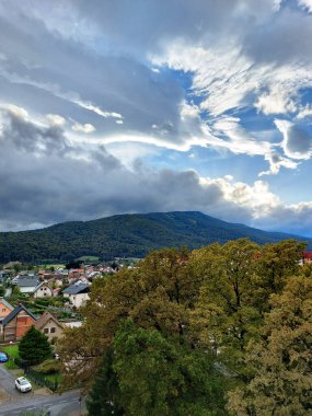 large clouds and green Pohorje Mountains. Slovenia. Maribor. Autumn.  clipart