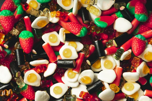 mountain of candy strawberries licorice and fried eggs