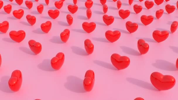 Glänsande Röd Reflekterande Hjärtan Snurra Rotera Ovanför Enkla Rosa Golv — Stockvideo
