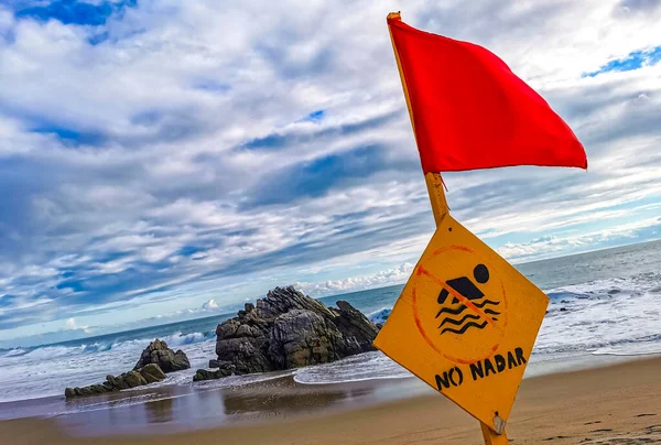 stock image Red flag swimming prohibited high waves in Zicatela Puerto Escondido Mexico.