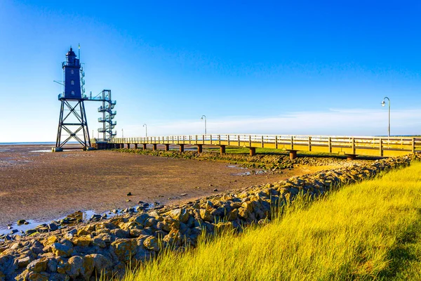 stock image Black lighthouse tower Obererversand in Wadden Sea landscape in Dorum Wurster North Sea coast Wursten Cuxhaven Lower Saxony Germany.