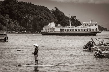 Ilha Grande 23. November 2020 Old black and white picture of Boats ships and Boat trips from Abraao beach Ilha Grande Angra dos Reis Rio de Janeiro Brazil. clipart