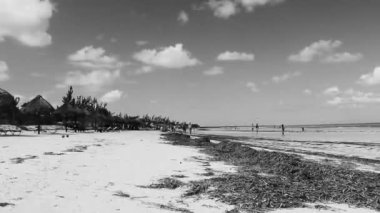 Holbox Mexico 22. December 2021 Panorama landscape view on beautiful Holbox island beach with people and turquoise water in Quintana Roo Mexico.