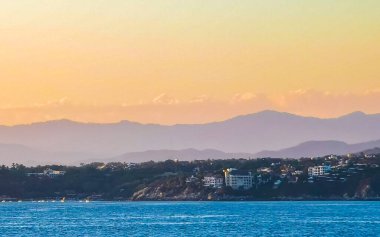 Mountains and cliffs by the sea for sunset in Zicatela Puerto Escondido Oaxaca Mexico.