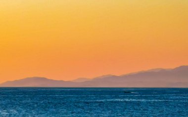 Mountains and cliffs by the sea for sunset in Zicatela Puerto Escondido Oaxaca Mexico.