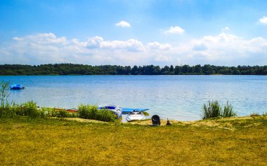 Beautiful north German lake with blue sky in summer in Hagen in Bremischen Cuxhaven Lower Saxony Germany.